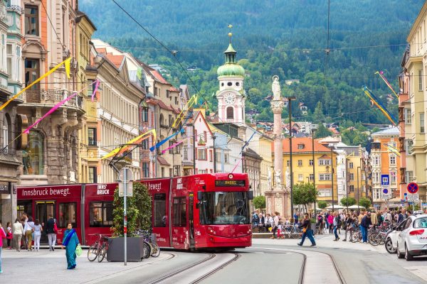 INNSBRUCK, AUSTRIA - JUNE 23, 2016: City train in Innsbruck in a beautiful summer day, Austria on June 23, 2016